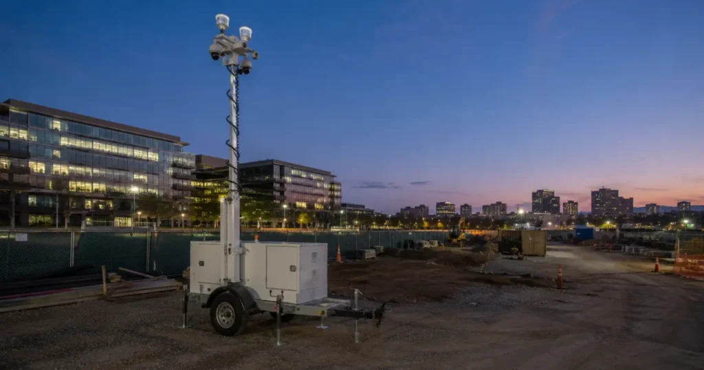 San Jose construction site with surveillance trailer at twilight