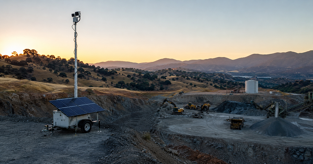 NorCal quarry and mine site at dawn with solar surveillance trailer monitoring operations